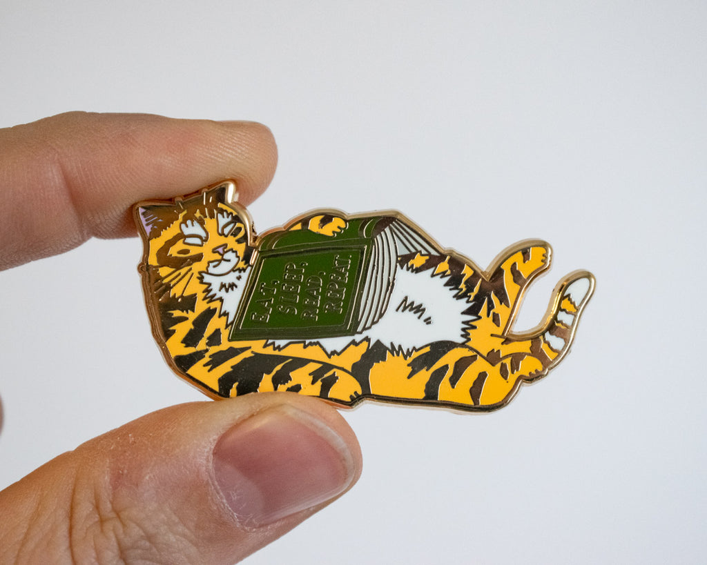 Eat, sleep, read, repeat - Hard Enamel Pin