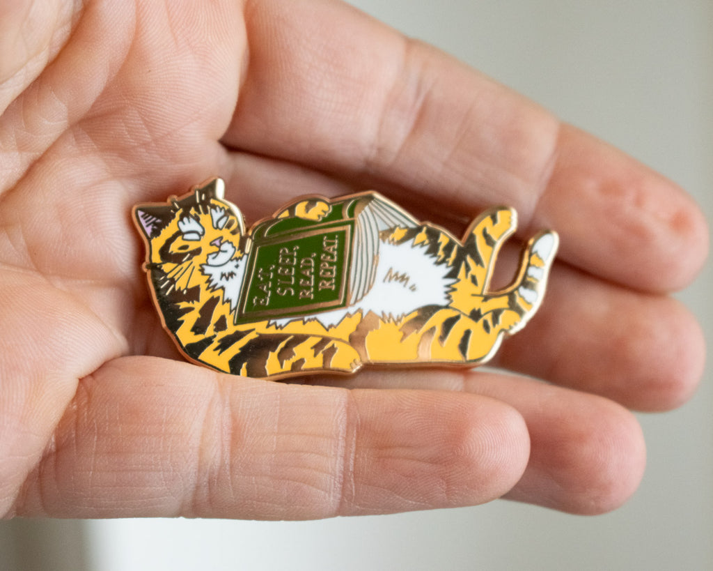 Eat, sleep, read, repeat - Hard Enamel Pin