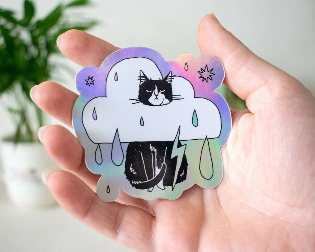 Rain Cloud Cat - Light mode | Holographic Vinyl Stickers of a grumpy Tuxedo Cat in a rain cloud costume