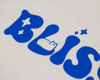 Bliss t-shirt | Hand screen printed on sand/beige organic cotton tee with blue comic style illustration of a tabby cat getting comfy