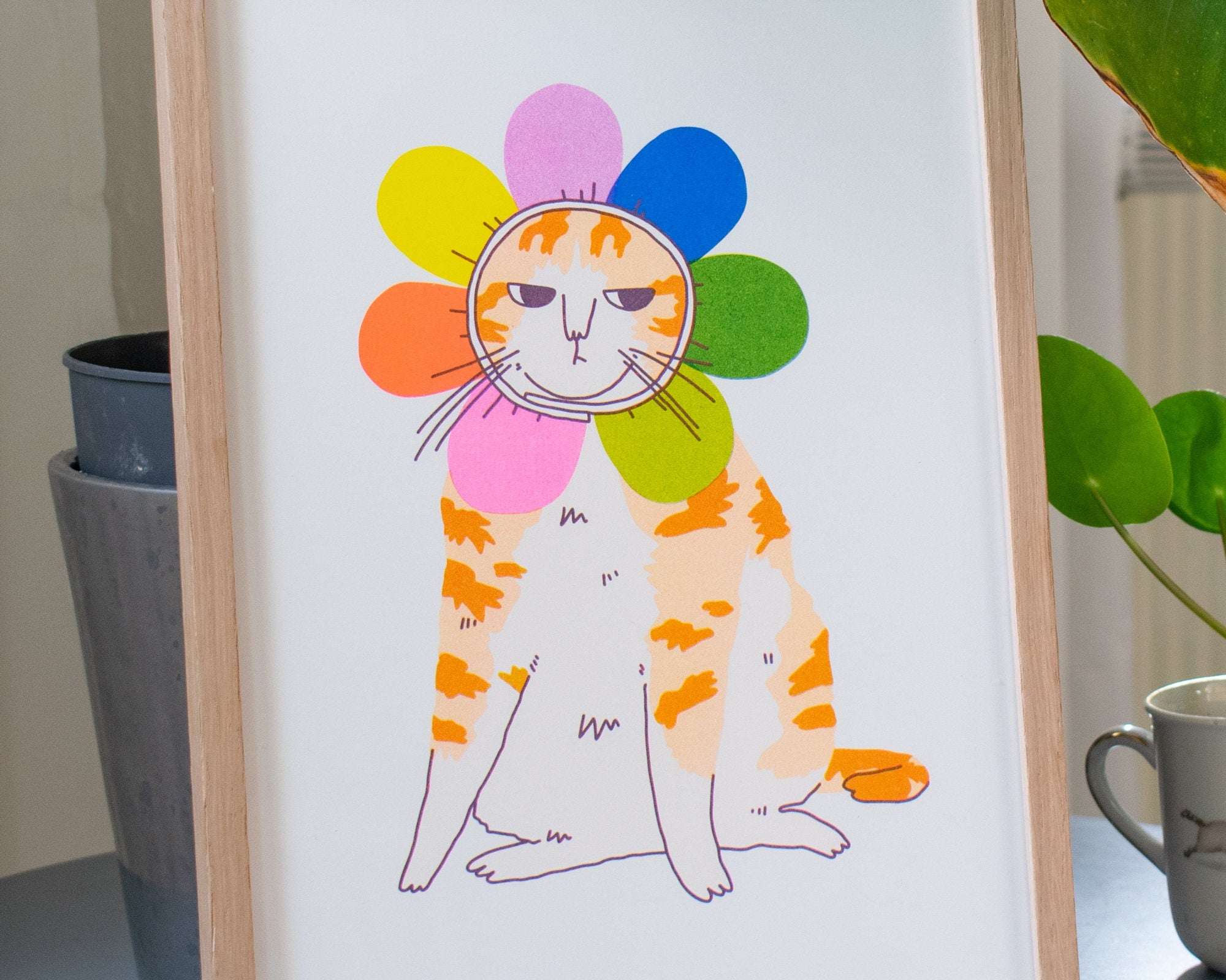 Grumpy Flower A4 Risograph poster | Illustration in fluorescent pink, blue and yellow of an angry looking cat in a flower costume