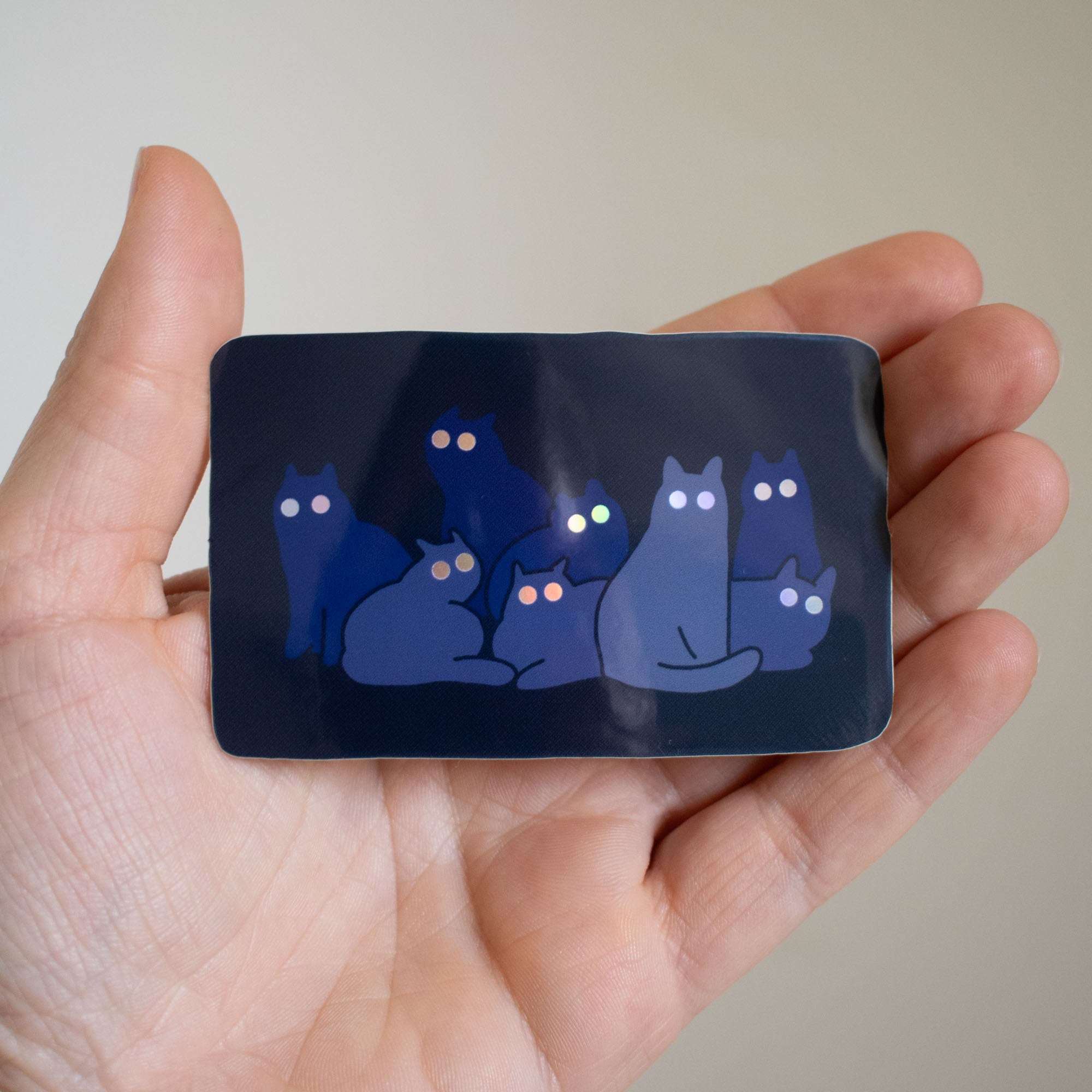 Reflecting Cat Eyes | Spooky holographic vinyl sticker of a cat gangs silhouettes who's eyes are glowing in the night