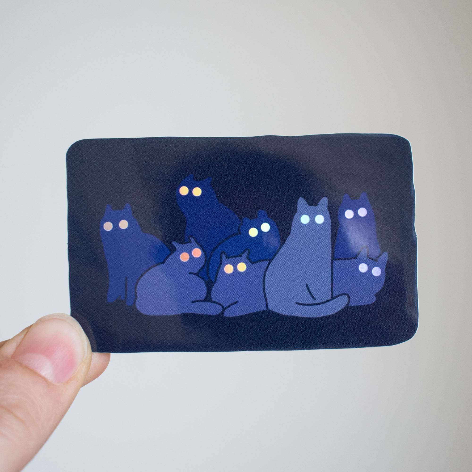 Reflecting Cat Eyes | Spooky holographic vinyl sticker of a cat gangs silhouettes who's eyes are glowing in the night