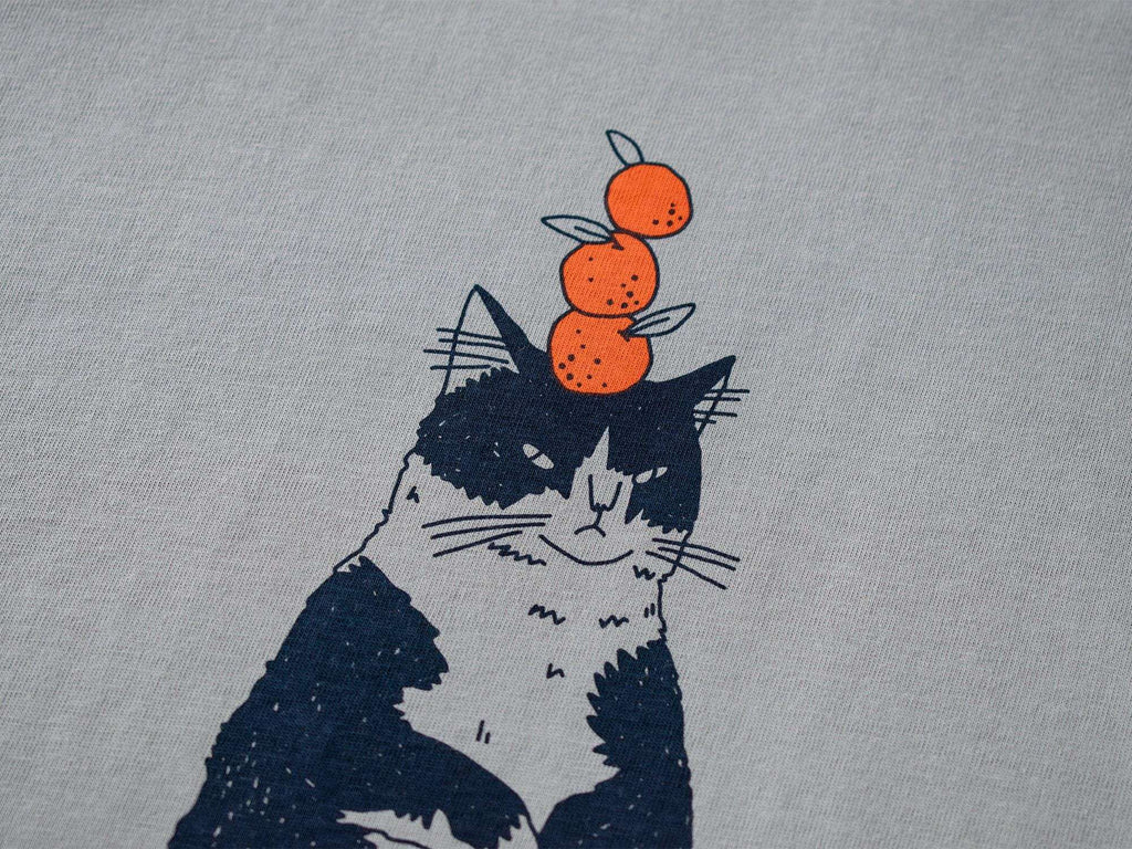 Orange Cat t-shirt | Hand screen printed illustration of a cat balancing oranges on grey organic cotton tee with navy and orange