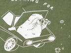 T-shirt: Looking for f***s to give | Hand screen printed olive green organic cotton tee with white illustration of a cat with binoculars