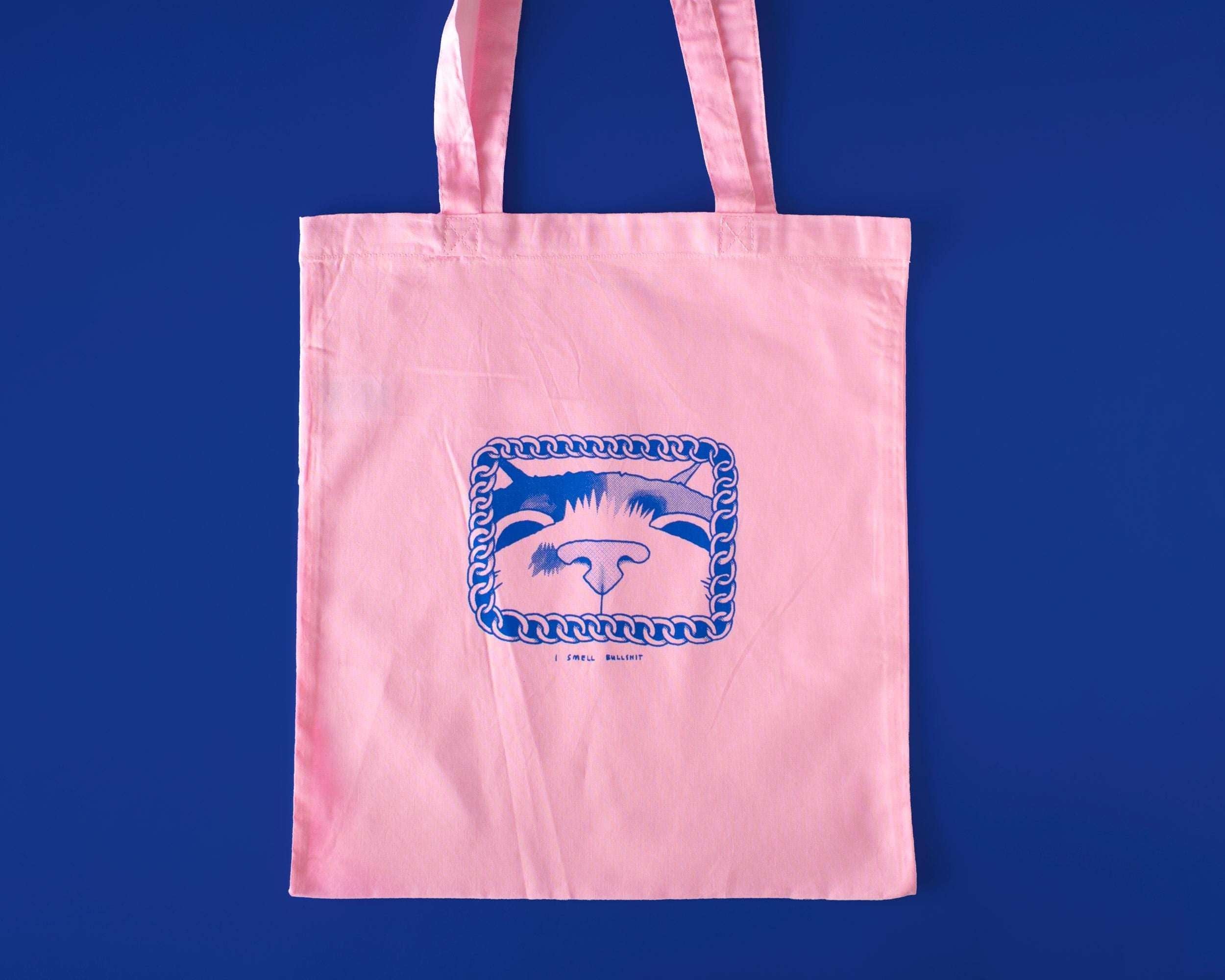 I smell bullshit tote bag | Hand screen printed light pink 100% cotton tote bag with illustration of a cat sniffing out lies