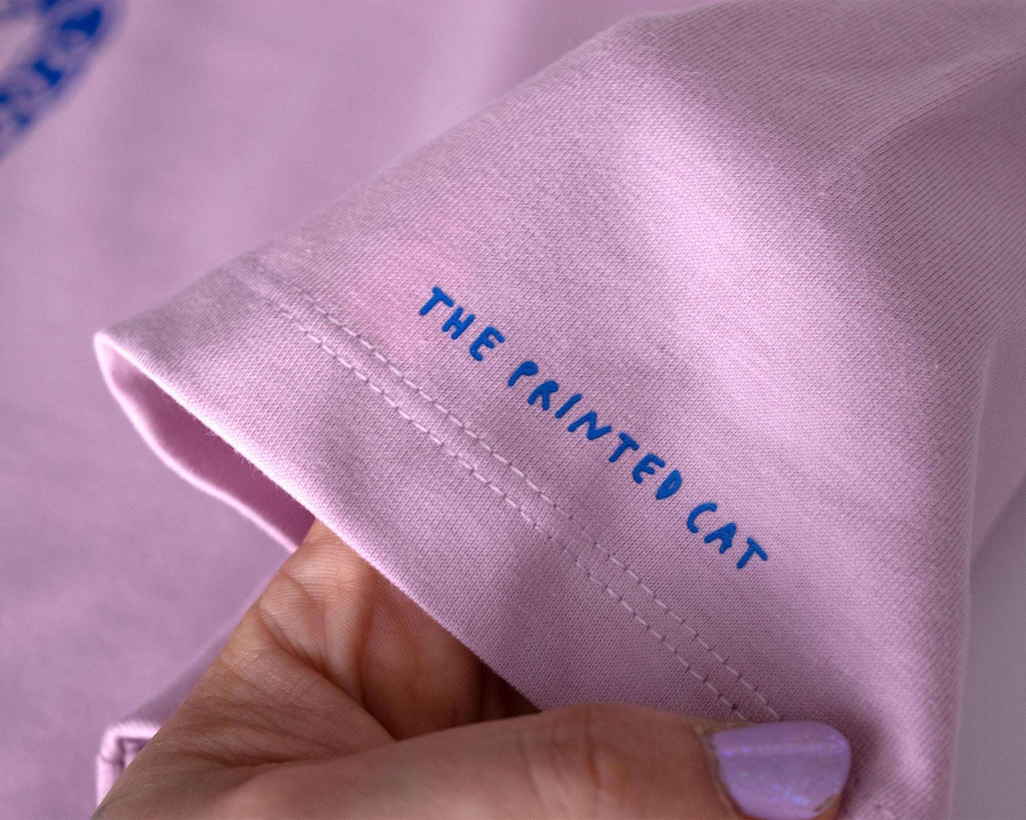 I smell Bullshit t-shirt | Hand screen printed on lilac organic cotton tee with blue illustration of a cat sniffing out your lies
