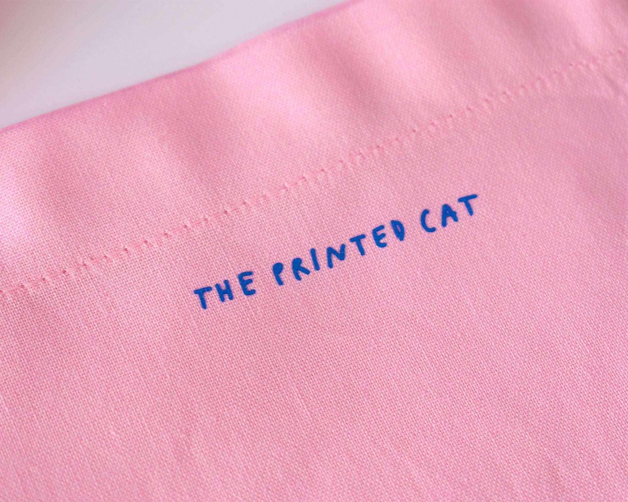 I smell bullshit tote bag | Hand screen printed light pink 100% cotton tote bag with illustration of a cat sniffing out lies