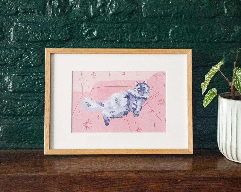 Cozy Sunday | Giclée cat art print of a grey fluffy cat chilling on a dusty rose couch
