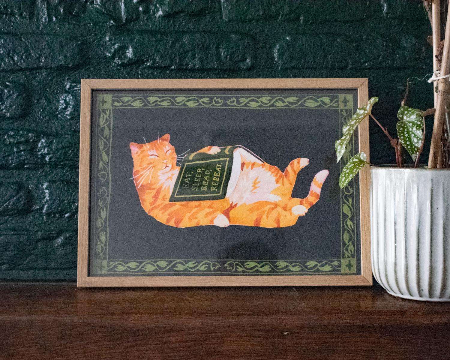 Eat, sleep, read, repeat | Giclée art print for bookish people of a sleepy orange cat with a book on its belly