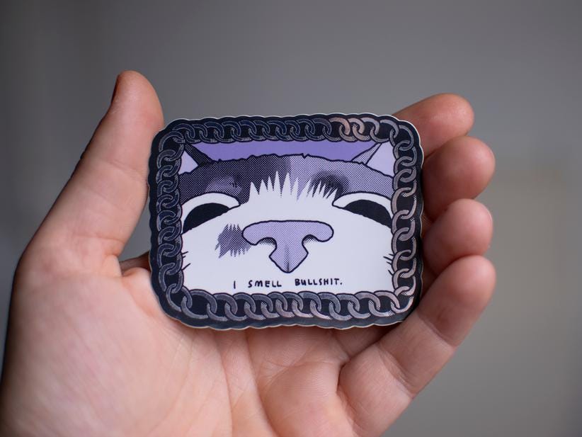 I smell bullshit | Funny chrome vinyl sticker of a cat that sniffs the viewer and calls out their bullshit framed with a silver chain
