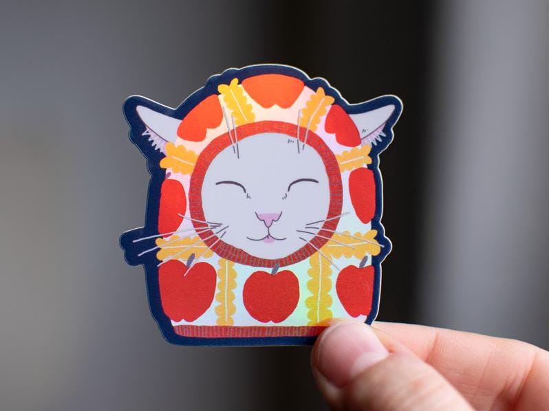 Apple Balaclava Cat Sticker: Holographic Vinyl Decal