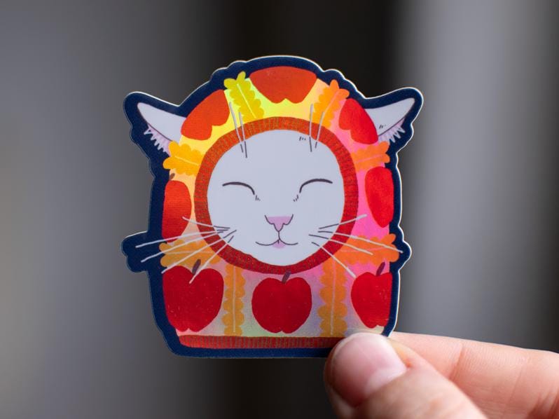 Apple Balaclava Cat Sticker: Holographic Vinyl Decal