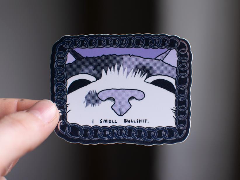 I smell bullshit | Funny chrome vinyl sticker of a cat that sniffs the viewer and calls out their bullshit framed with a silver chain