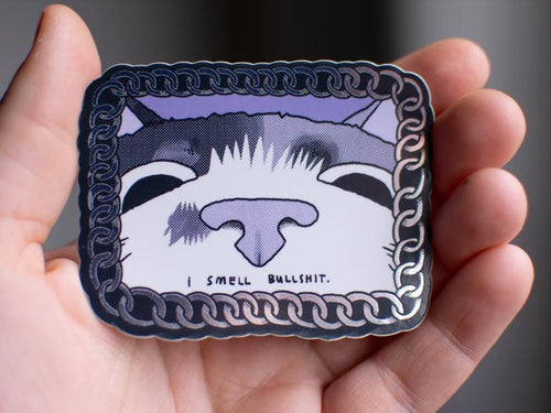 I smell bullshit | Funny chrome vinyl sticker of a cat that sniffs the viewer and calls out their bullshit framed with a silver chain