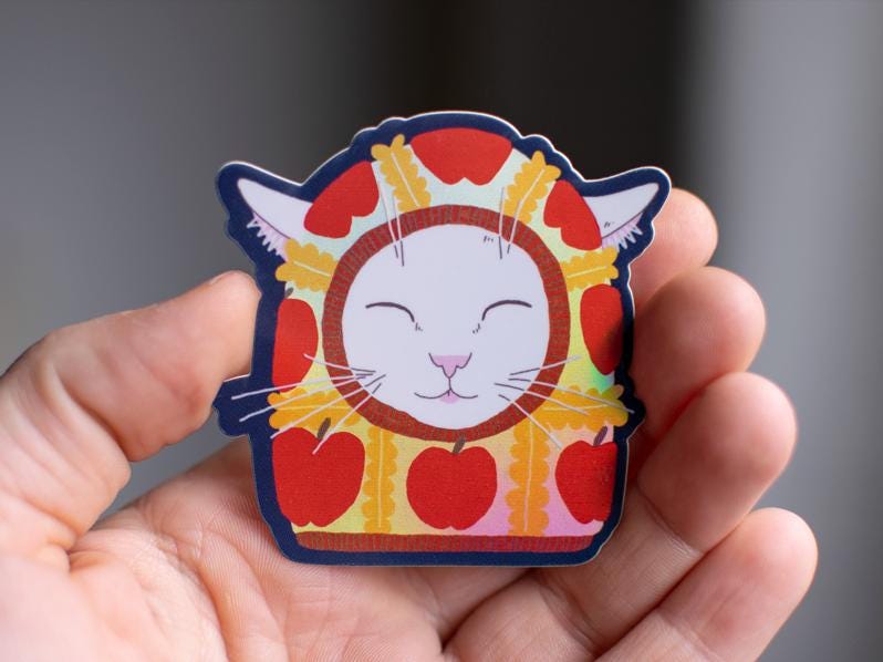 Apple Balaclava Cat Sticker: Holographic Vinyl Decal