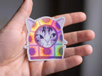Sunflower Balaclava Cat | Cute holographic vinyl sticker of a purple tabby cat wearing a balaclava with flowers on it
