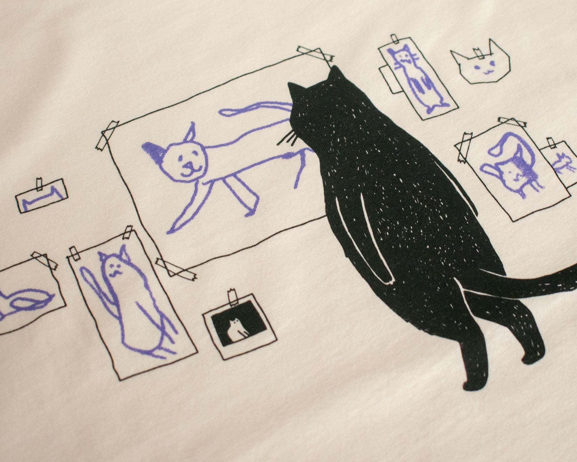 Cat gallery top | Hand screen printed on ecru organic cotton sleevless cropped top with black and blue illustration of a cat judging cat art