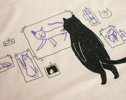Cat gallery top | Hand screen printed on ecru organic cotton sleevless cropped top with black and blue illustration of a cat judging cat art