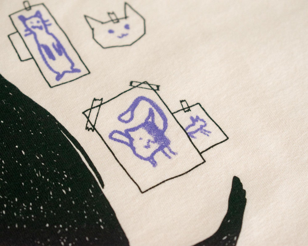 Cat gallery top | Hand screen printed on ecru organic cotton sleevless cropped top with black and blue illustration of a cat judging cat art
