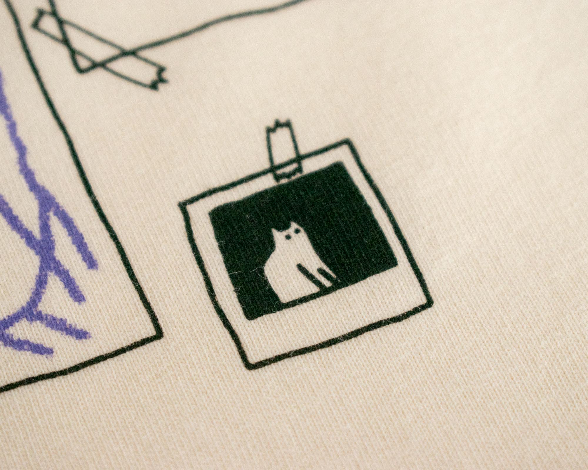 Cat gallery top | Hand screen printed on ecru organic cotton sleevless cropped top with black and blue illustration of a cat judging cat art