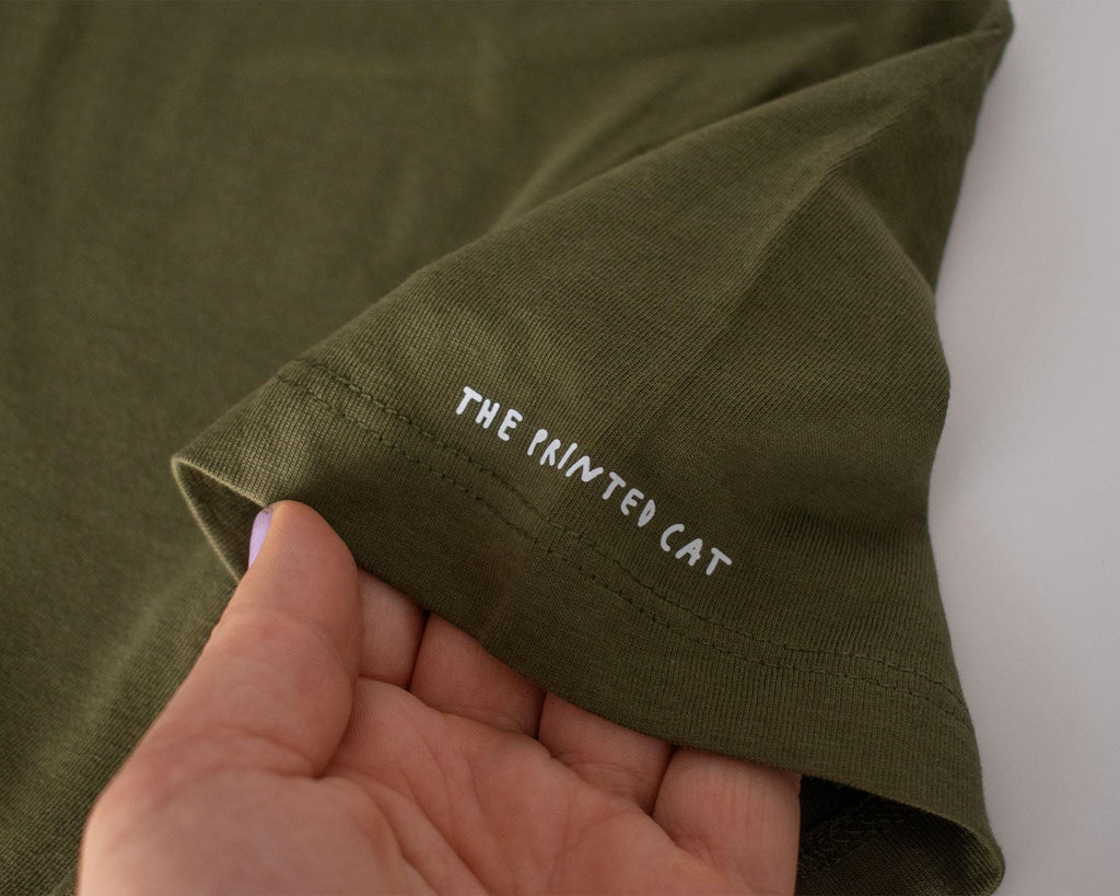 Looking for f***s to give crop top | Hand screen printed olive green 100% cotton tee with white illustration of a cat with binoculars