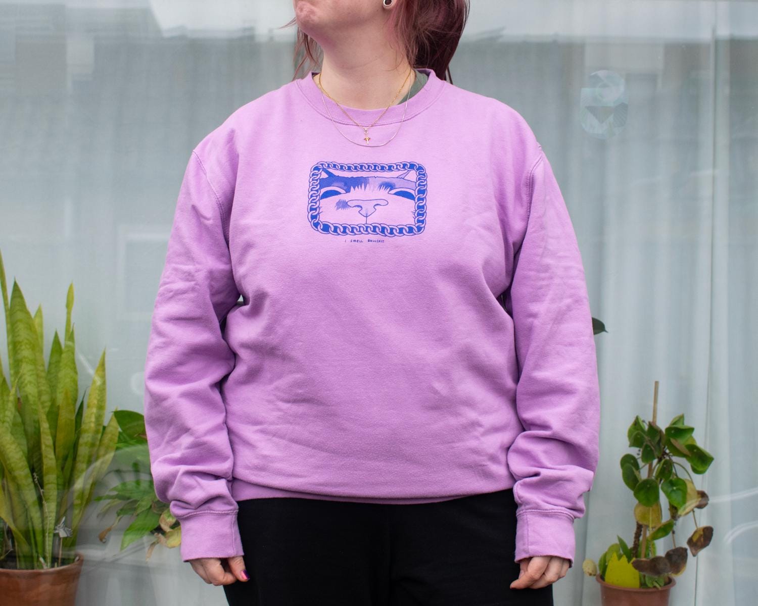 I smell bullshit cat sweatshirt with a hand screen printed illustration of a cat sniffing out lies