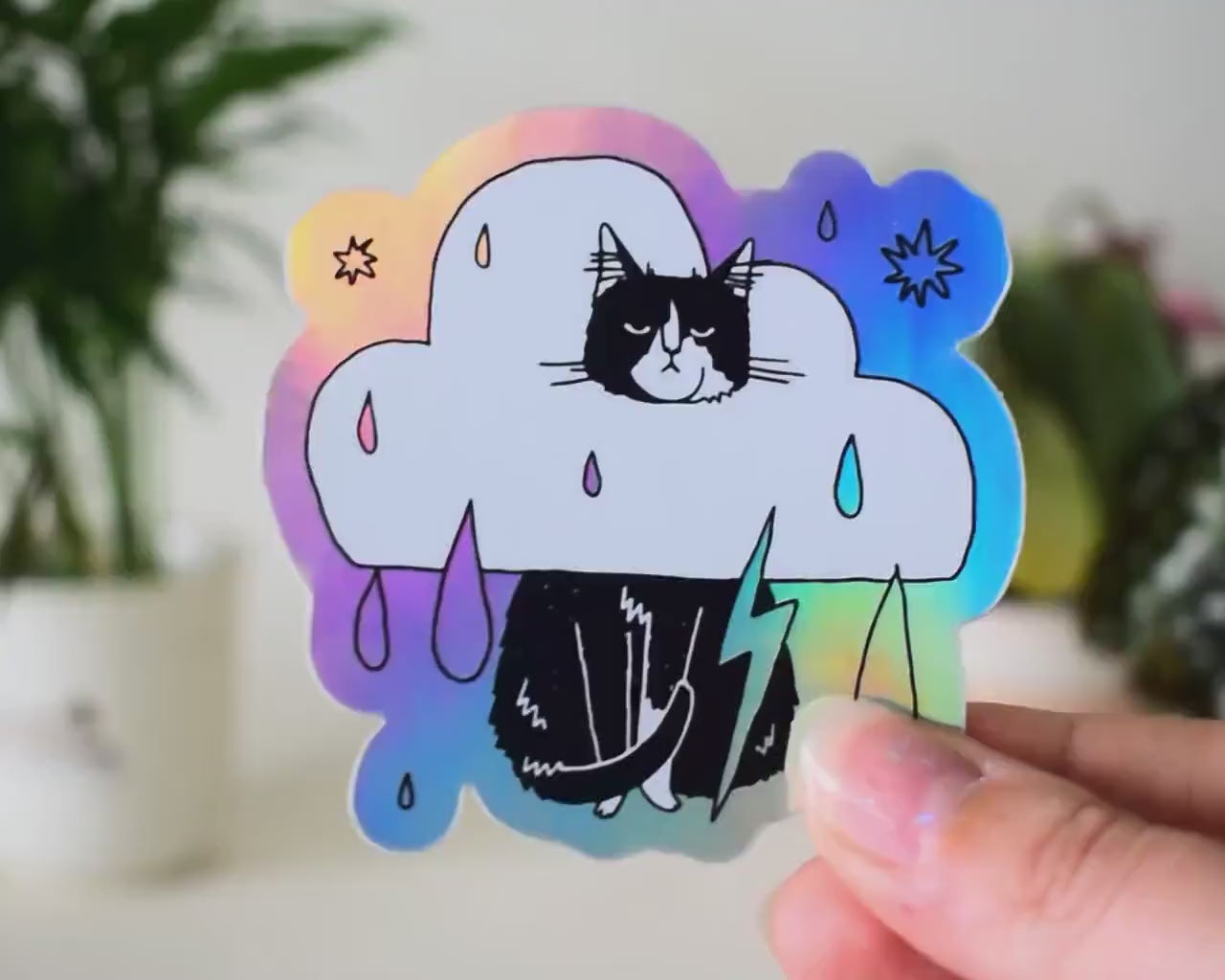 Rain Cloud Cat - Light mode | Holographic Vinyl Stickers of a grumpy Tuxedo Cat in a rain cloud costume